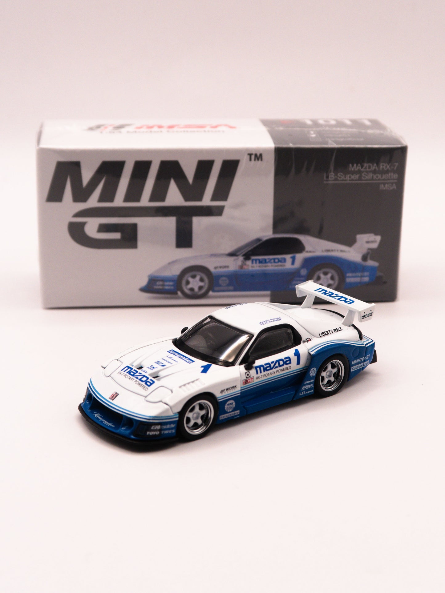 Mini GT #1011 Mazda RX-7 LB-Super Silhouette Biało-Niebieska IMSA Racing