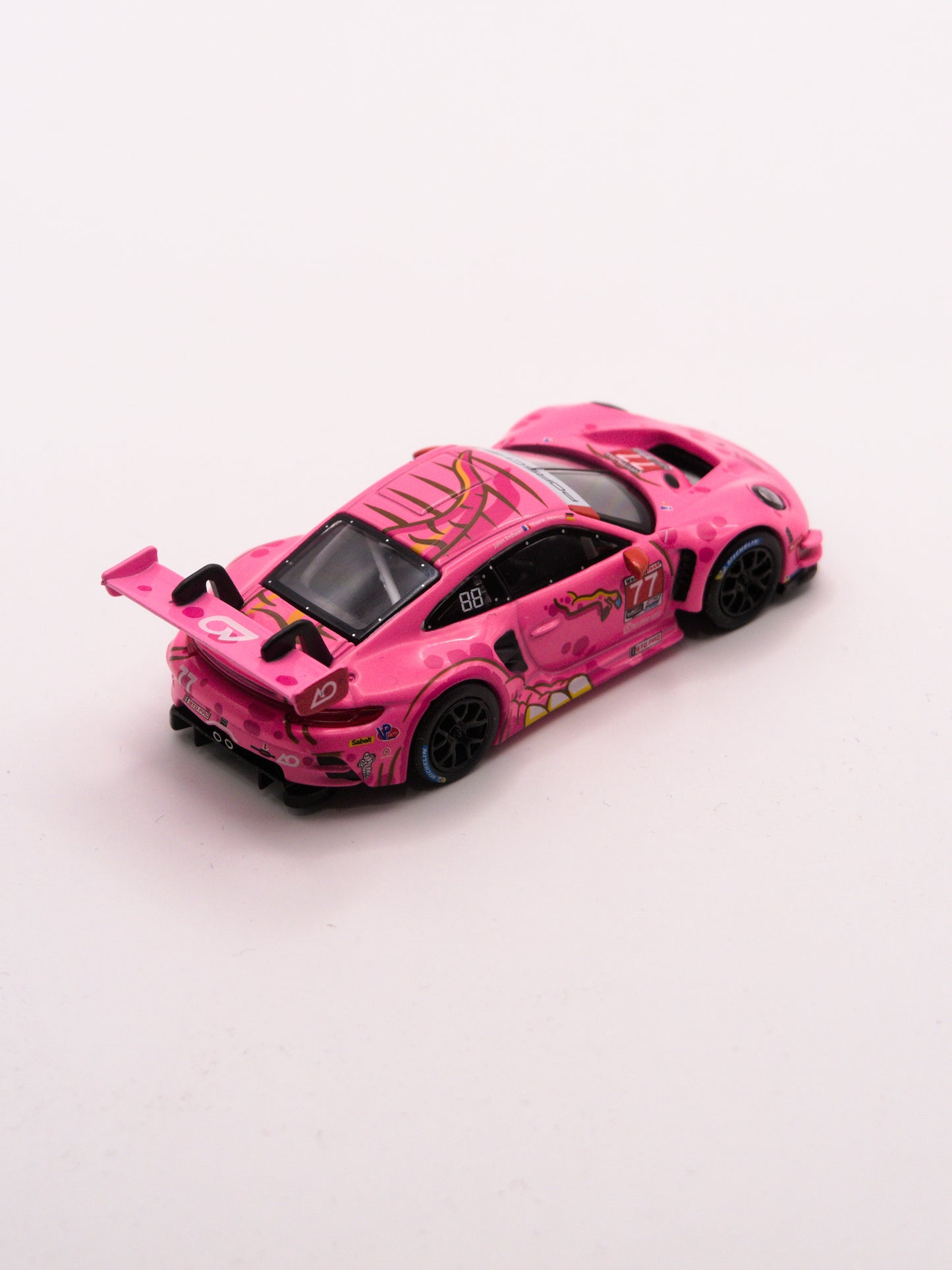 Mini GT #1052 ROXY Porsche 911 GT3 R #77 2024 IMSA ROAD AMERICA AO Racing Różowy