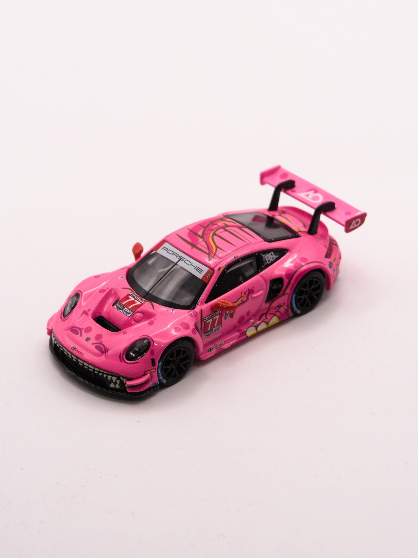 Mini GT #1052 ROXY Porsche 911 GT3 R #77 2024 IMSA ROAD AMERICA AO Racing Różowy