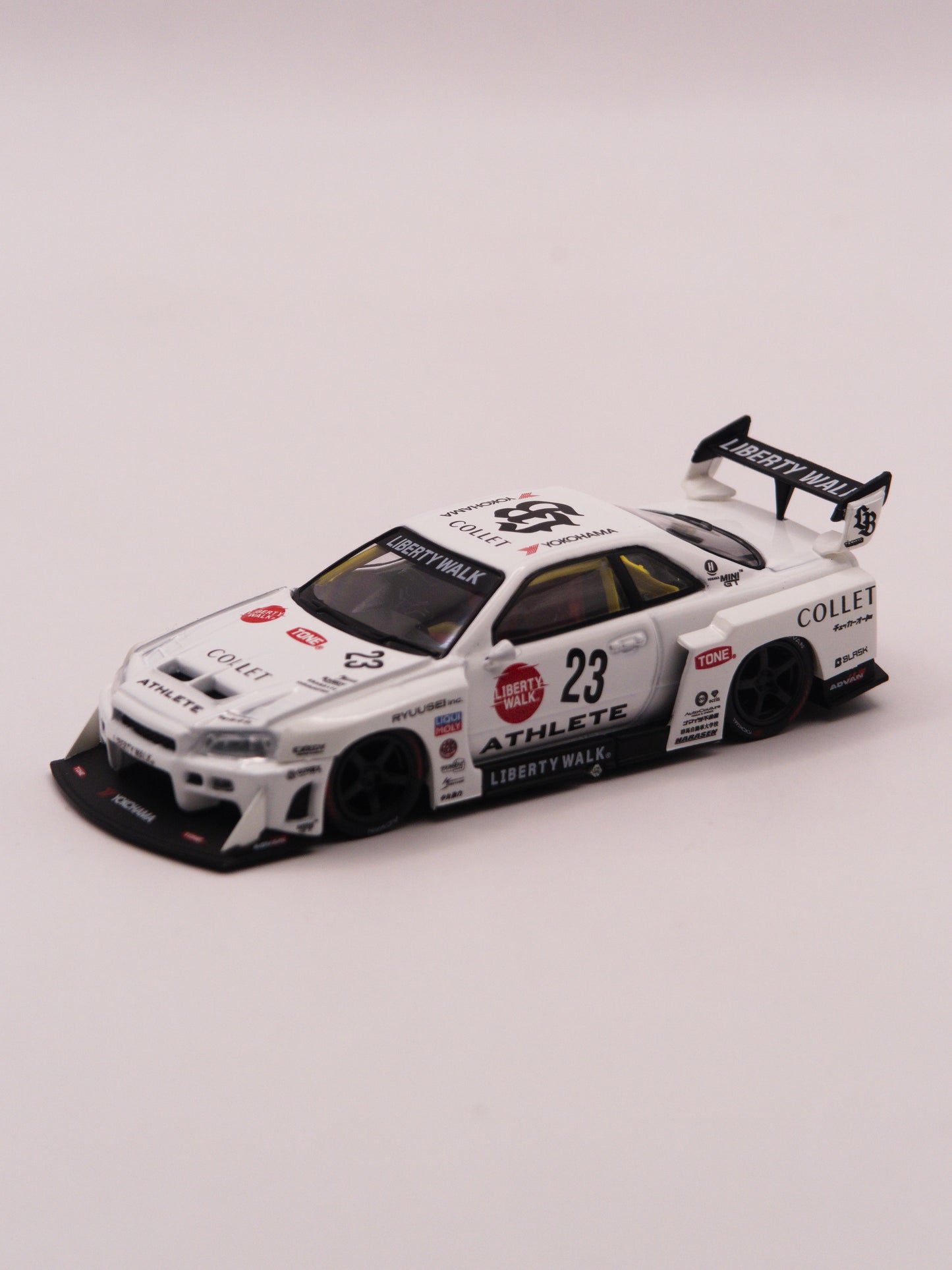 Mini GT #1059 Nissan Skyline GT-R R34 Liberty Walk Super Silhouette Athlete Biały