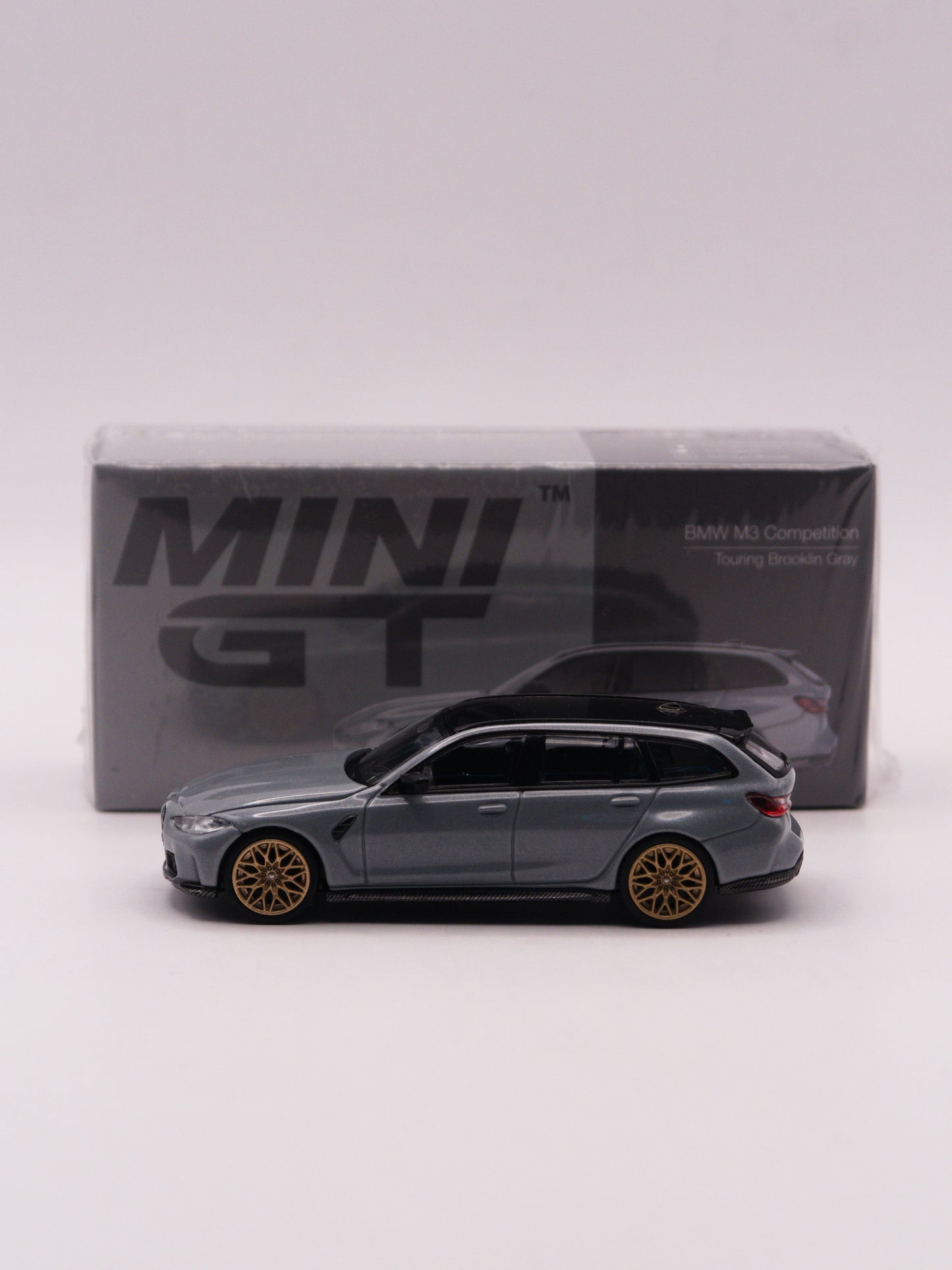 Mini GT #864 BMW M3 Touring Competition Szary